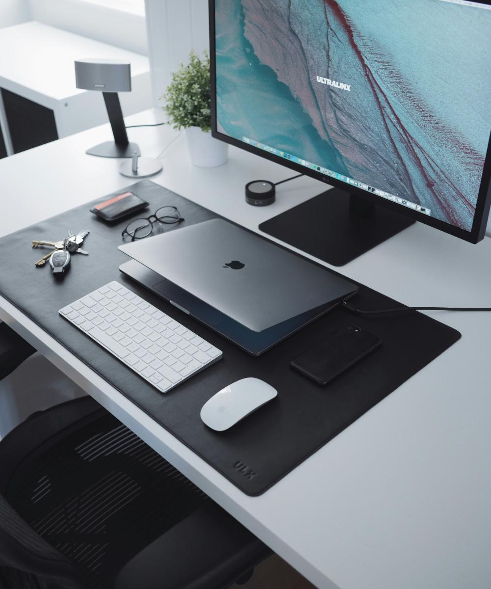 turn on flat screen television beside silver MacBook by Oliur courtesy of Unsplash.